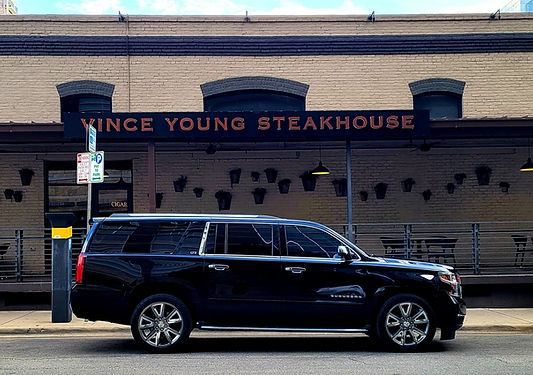Black Suburban outside Vince Young Steakhouse Austin